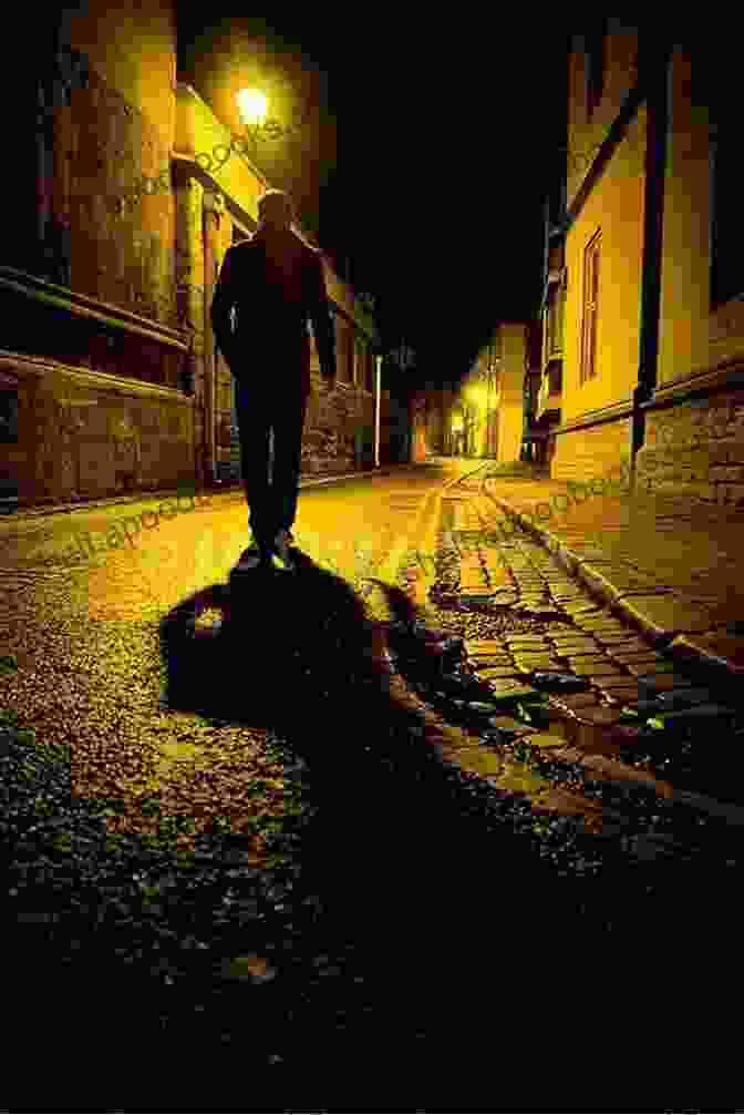 A Dark And Shadowy Urban Alleyway At Night, With A Lone Figure Walking Through It. Sightseer In This Killing City (Penguin Poets)