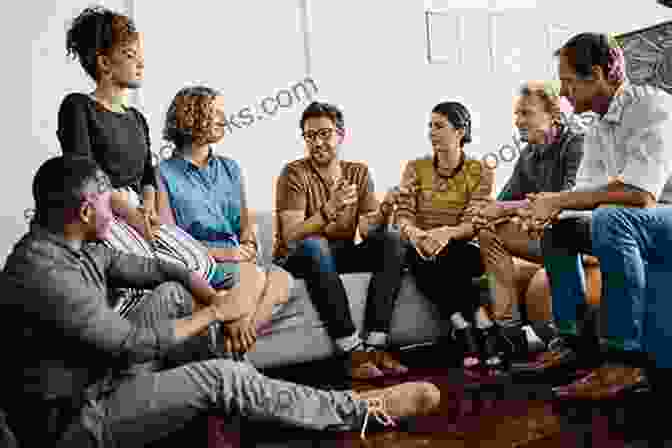 A Motorcyclist Sits At A Table With A Group Of People, Sharing A Meal And Laughter, Emphasizing The Power Of Human Connection On The Road. Eight Wheels And A Prayer