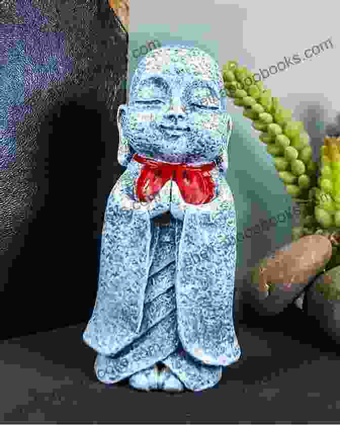 A Serene Stone Statue Of Jizo Bodhisattva, Adorned With A Red Bib And Holding A Staff And Jewel Jizo Bodhisattva: Modern Healing Traditional Buddhist Practice